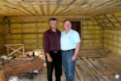 Part Of The Activities Center As It Neared Completion. The Insulation And Finished Walls Were Not Yet Completed. Shown Here Is Alex Who, With His Wife, Lena, Supervised The Construction Of the Center And Actually Did Much Of The Work Free.