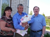 Lena and Alex, Who Have Hosted Me So Many  Times. He Is Holding A New Grand Baby.  Kazilovka, Ukraine, May, 2010. 